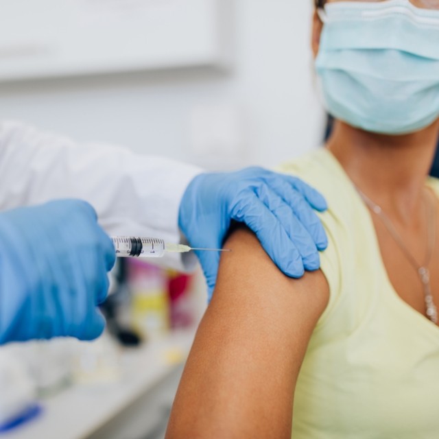 Woman receiving a flu vaccine