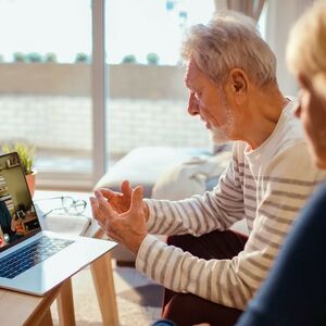 Senior couple looking at computer