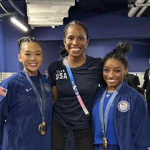 From left: Suni Lee, Marcia Faustin, MD 13, FAAFP, and Simone Biles at the 2024 Paris Olympics.