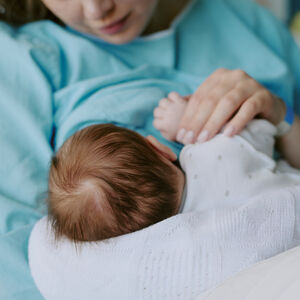 Mother breast feeding a baby