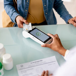 Woman paying with credit card