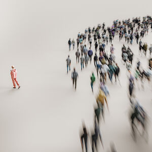 Image of a woman taking her own path among the crowd of people