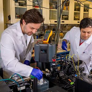 Two students working in a quantum lab